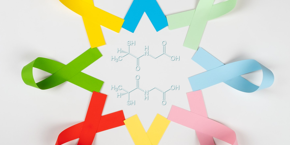 foto di nastri colorati per consapevolezza malattie con formula tiopronina al centro
